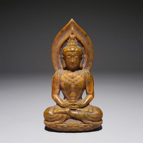 A beautiful seated statue of Hetian jade Buddha