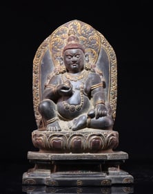 A beautiful black stone carved yellow God of Wealth