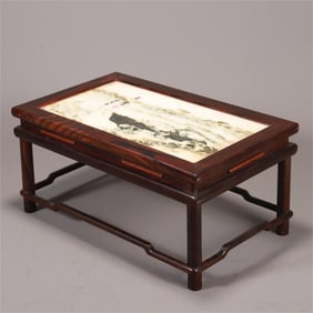 A beautiful small table with wood carvings and stone slabs