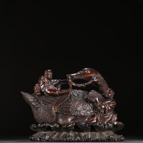 A Qing Dynasty agarwood boy goose ornament