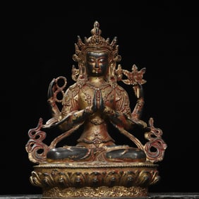 A four-armed Guanyin statue with bronze rubbings