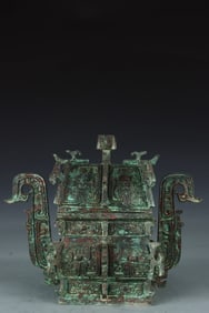A bronze square tripod