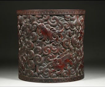 A Qing Dynasty Huanghuali sea beast pattern pen holder