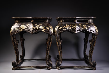 A pair of gilded lacquerware stools