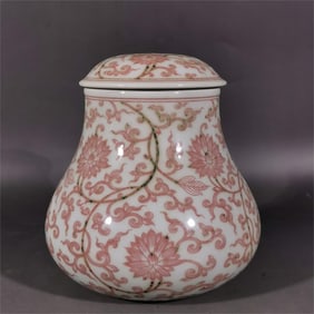 A red entwined lotus pattern tea jar in the Qing Qianlong glaze