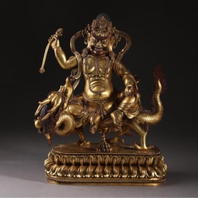 A Qing Dynasty precisely cast bronze gilt white statue of the god of wealth