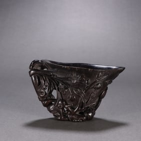 A precious horn carved orchid pattern cup of the Qing Dynasty