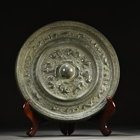 A bronze mirror with a sea beast inscription from the Sui and Tang dynasties