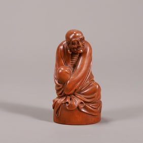 A beautiful boxwood dharma ornament