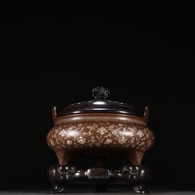 A copper tire floral pattern aroma burner in the stone old style