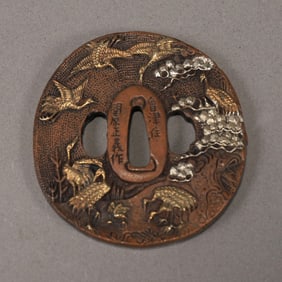 A beautiful bronze carved crane handle