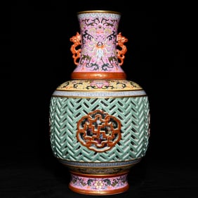 A Qing Dynasty Qianlong year foreign color hollow inner boy dragon boat turning heart vase