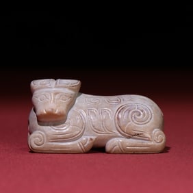 A beautiful gray skin jade cow ornament