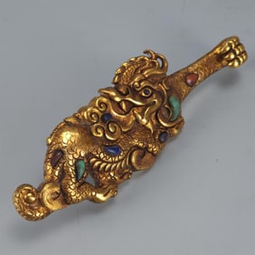 A fine copper gilt strap hook
