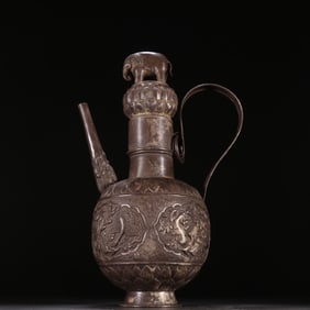 A sterling silver engraved flower and bird pattern wine jug from the Qing Dynasty