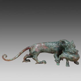 A fine bronze tiger eating deer