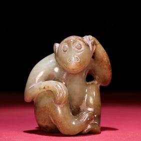 An exquisite Hetian jade birth pit full of jade monkey ornaments