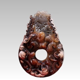 A beautiful red and white jade seed material is highly embossed out of the outline