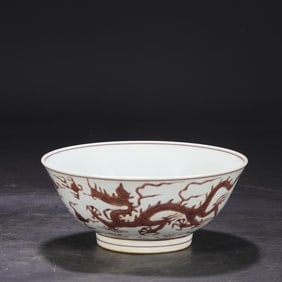 A Ming Dynasty Chenghua white background brown color carved seawater cloud dragon pattern