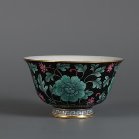 A master cup with a black background ink color entwined flower pattern made in the Yongzheng era of