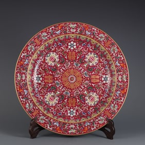 A carmine red pastel passionflower gold-painted swastika pattern folded edge plate made in the Qing