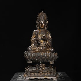 A bronze gilt statue of Guanyin