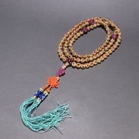 A silver-gilt tourmaline one hundred and eight Buddha beads of the Qing Dynasty