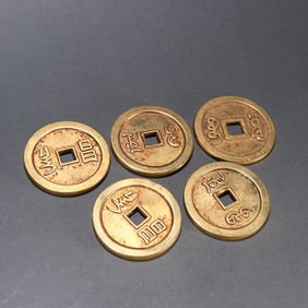 A copper-gilt Five Emperors coin of the Qing Dynasty