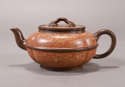 A beautiful twisted purple clay pot