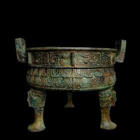 A bronze beast-faced three-legged round tripod of the Shang and Zhou dynasties