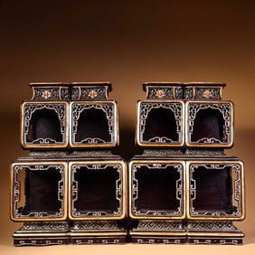 A pair of antique racks with large wooden lacquerware painted with gold