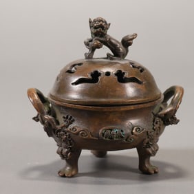 A beautiful bronze carved double animal ear three-legged stove