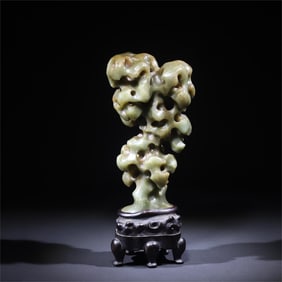 A beautiful green jade Taihu Lake stone ornament