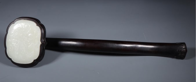 A beautiful Hetian jade-inlaid mahogany Fushou ruyi ornament