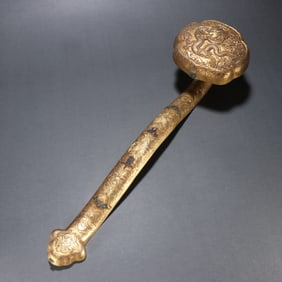 A copper gilt dragon pattern ruyi handle of the Qing Dynasty