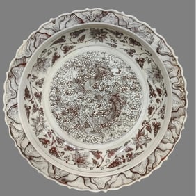 A glazed red cloud dragon entwined lotus plate in the Yuan Dynasty