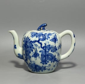 A blue and white butterfly love melon and fruit teapot made in the Qianlong period of the Qing