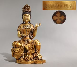 A bronze gilt seated statue of Guanyin