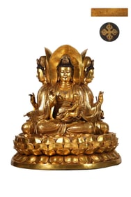 A seated statue of Guanyin with a gilt four-sided Guanyin in the Ming Dynasty