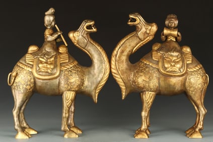 A pair of Tang partially gilt figurines riding camels
