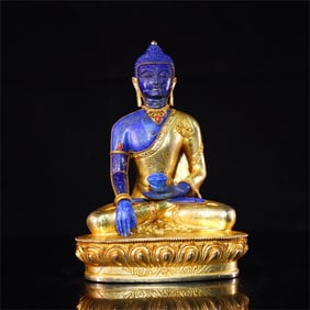 A beautiful copper-gilt inlaid lapis lazuli Buddha statue
