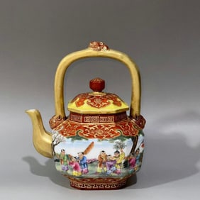 A Qing Dynasty Qianlong year alum red ground carved pattern filled with gold baby play figure