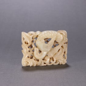 A piece of Hetian jade transparent carving crane in the Qing Dynasty wears a lotus tile