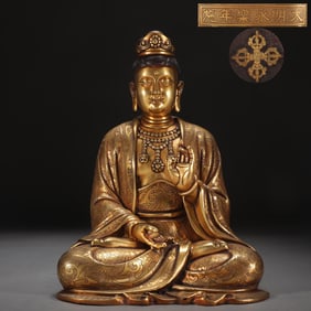 A bronze gilt seated statue of Guanyin