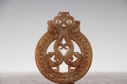 An ancient jade double dragon pendant