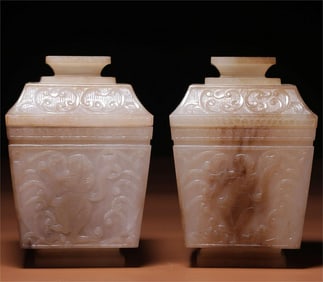 A pair of Qing Dynasty Hetian sugar white jade Hu people skills and music pictures square lid boxes