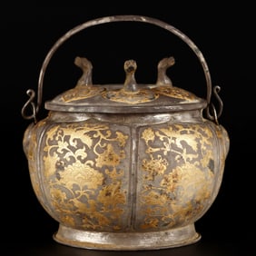 A Tang Dynasty sterling silver partially gilt can lifter