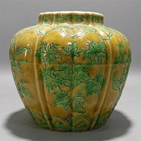 A yellow ground green folded branch flower multi-fruited melon edge jar of the Ming Dynasty
