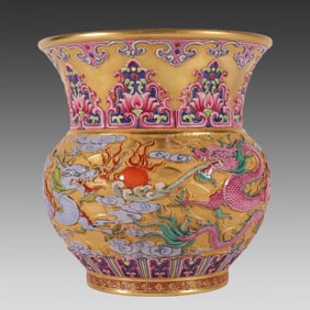 A Qing Dynasty Qianlong enamel carved gold ground double dragon slag bucket