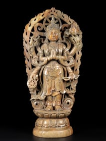 A beautiful Hetian jade six-armed Buddha statue